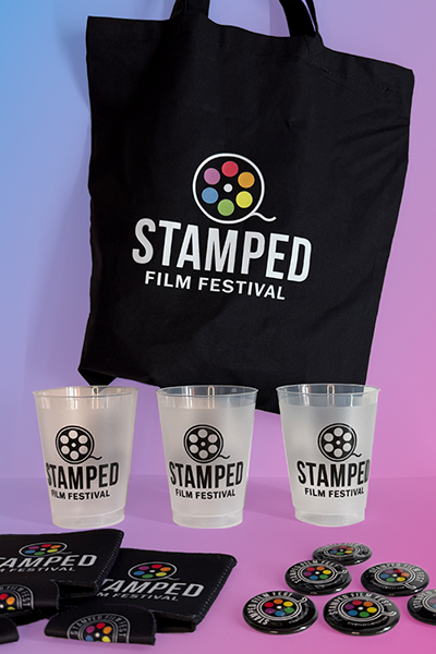 Branded merchandise and swag bag with frosted cups, custom buttons and koozies Swag tote bag including frosted custom cups, koozies and custom buttons.